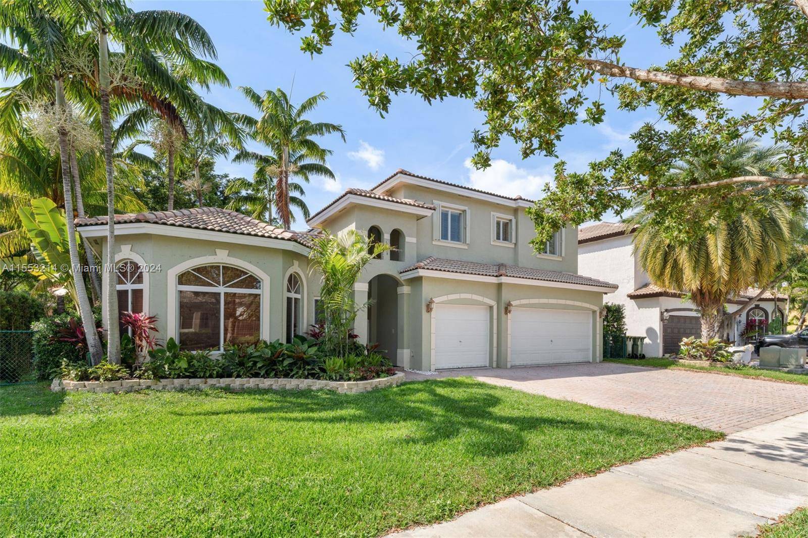 Indulge yourself in luxury living with this exquisite rare model 5BD 4BA home with separate in law quarters in highly sought after Keys Landings.