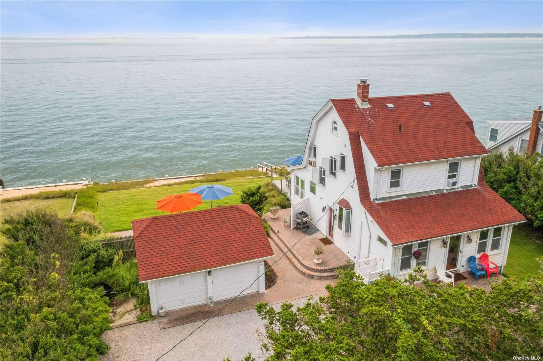 Enjoy the breathtaking views in this exclusive Bayfront home, 1 of 6 homes in a private entity on Little Peconic Bay.