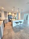 Renovated Chefs Kitchen which Opens to Dining and Living Room