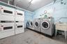 Shared laundry room featuring washing machine and dryer and stacked washer / dryer