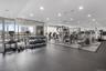 Exercise room featuring expansive windows and recessed lighting