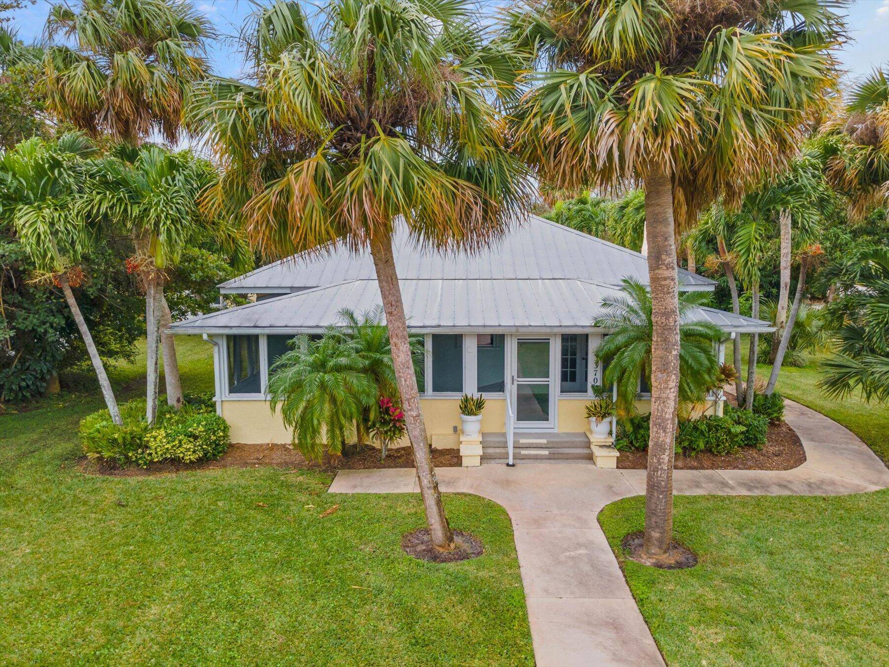 Nostalgia beckons from the bygone era with this opportunity to reside in Downtown Jensen Beach directly across from the Intracoastal Waterway.