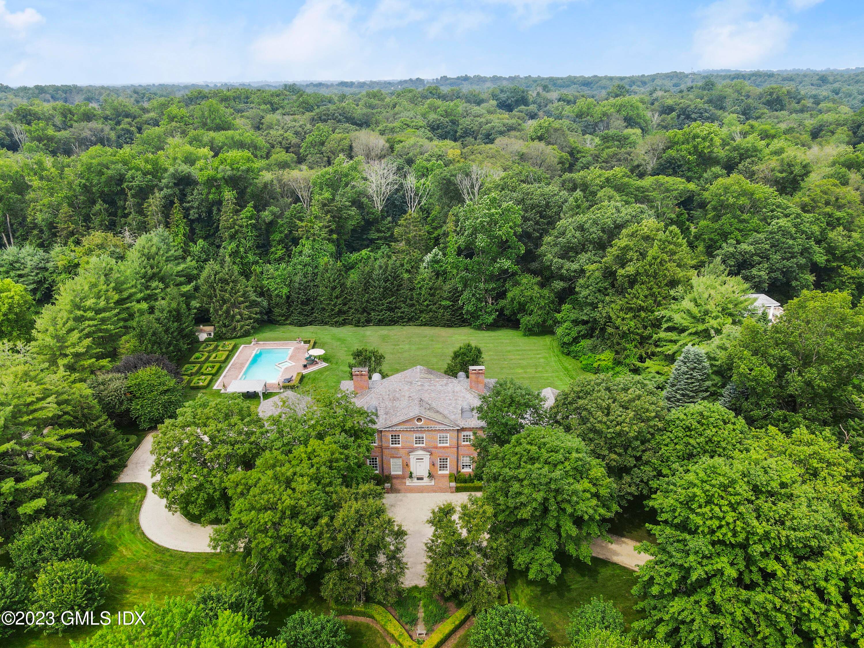 ANDREWS FARM This distinguished country estate overlooks 4 park like, level acres with a stunning pool and parterre gardens in an exclusive and gated private association.