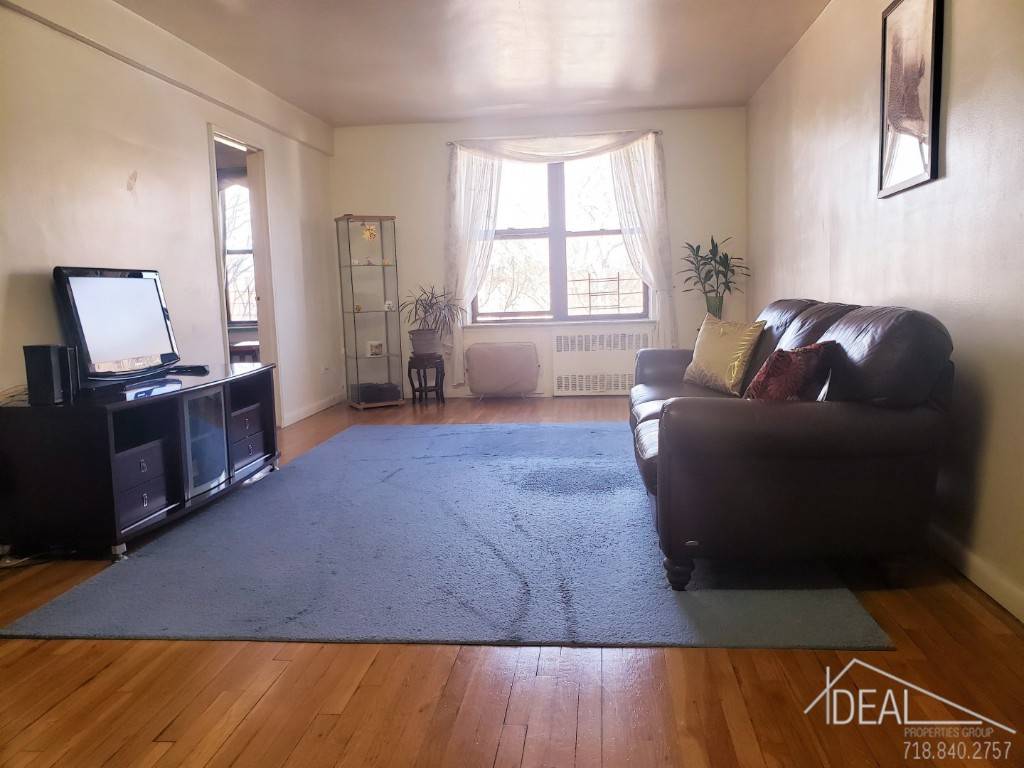 This spacious Western Queens two bedroom Co op apartment overlooks a tranquil treelined street.