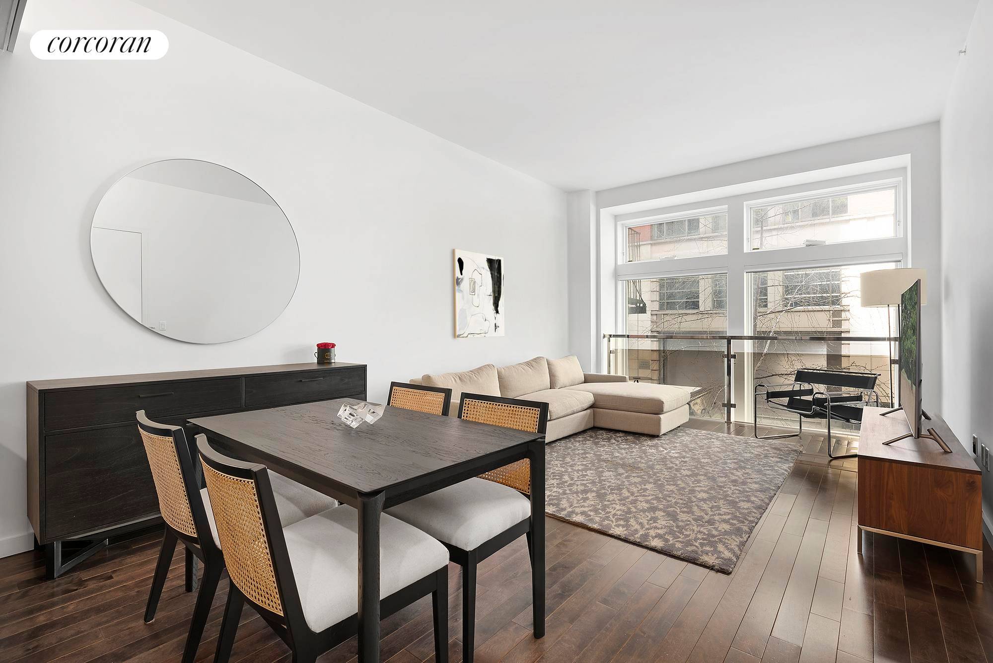 Gorgeous designer interiors, private outdoor space and treetop views await in this exquisite two bedroom plus home office contemporary brownstone condominium in the heart of the Flatiron District.