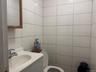 Bathroom featuring vanity and tile walls