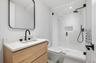 Full bath with vanity, a stall shower, and recessed lighting