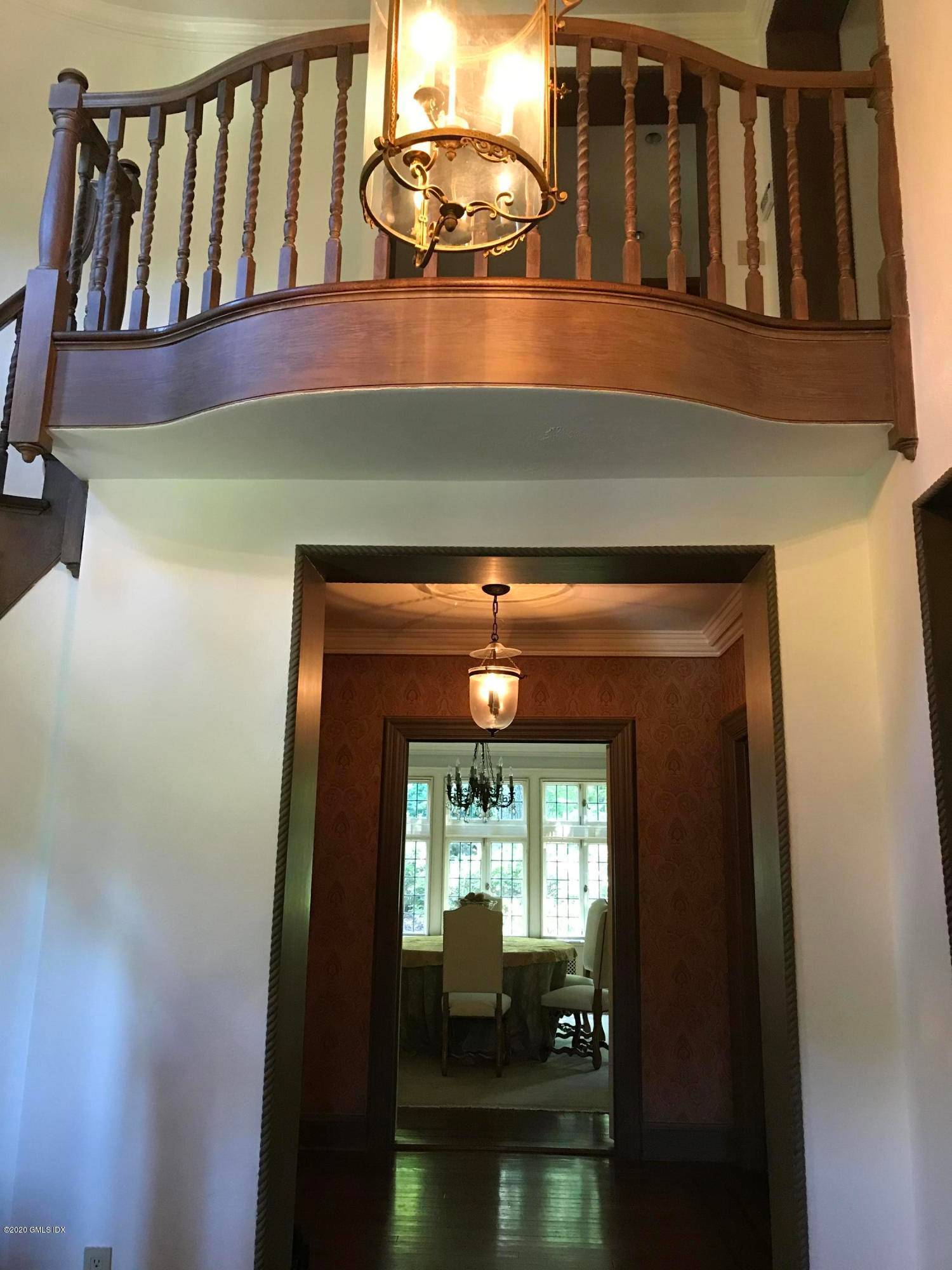 In a Gated Community, Milbrook Manor, offers elegance with high ceilings detailed moldings and hardwood floors on the first floor.