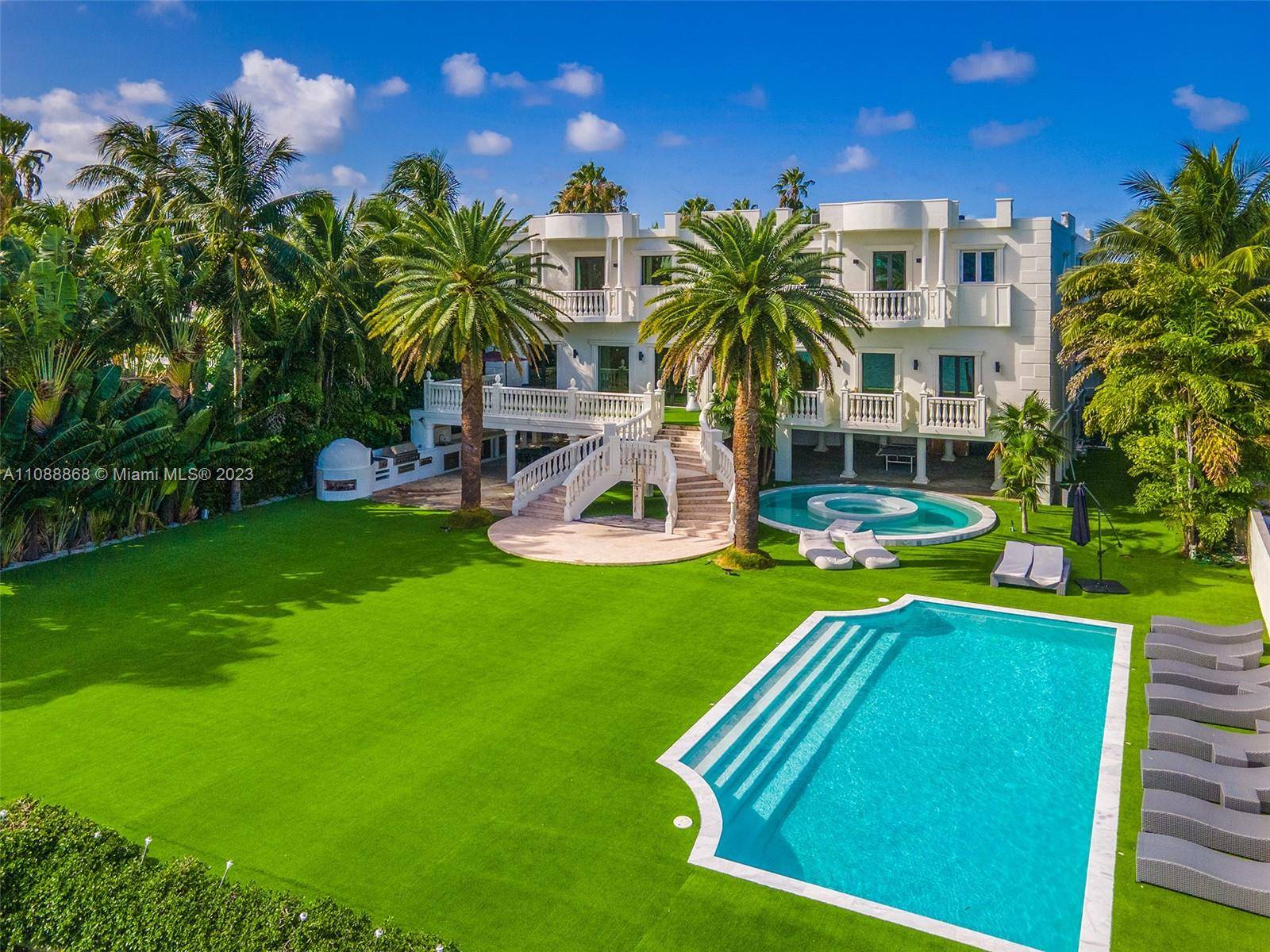 Located in the prestigious gated Palm Island, this grand residence is a rare opportunity.