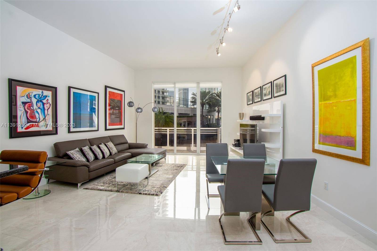 Spectacular totally furnished unit in the prestigious Carbonell with extra high ceilings and views to the Miami skyline.