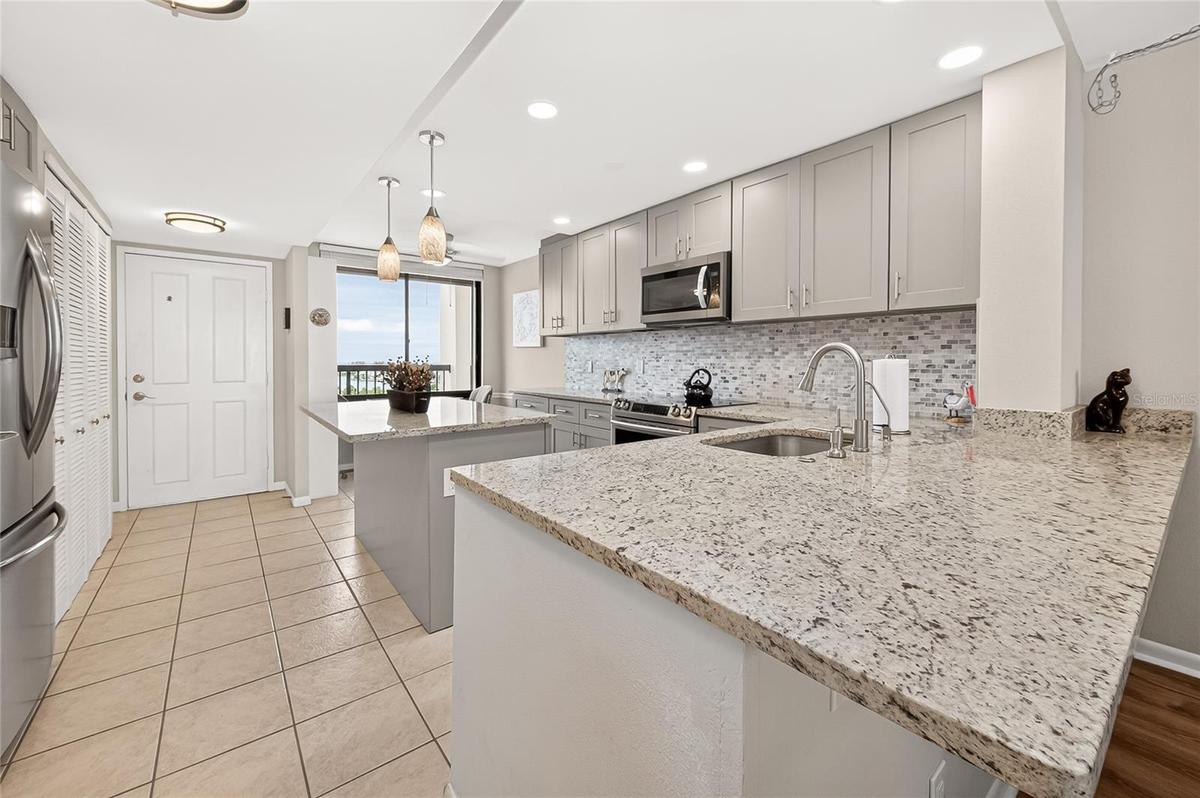 You can eat at the island, kitchen table or large breakfast bar