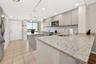 You can eat at the island, kitchen table or large breakfast bar