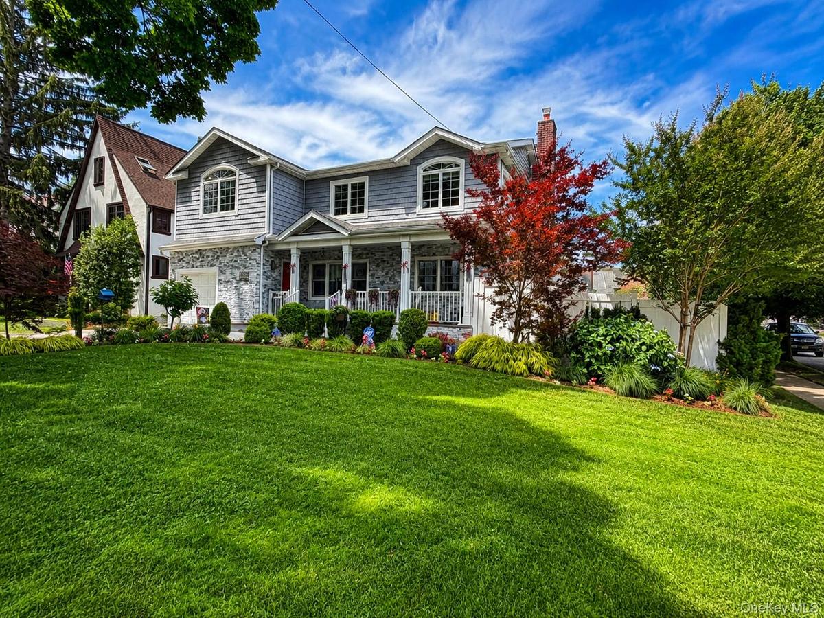 Oversized corner lot on tree lined street.