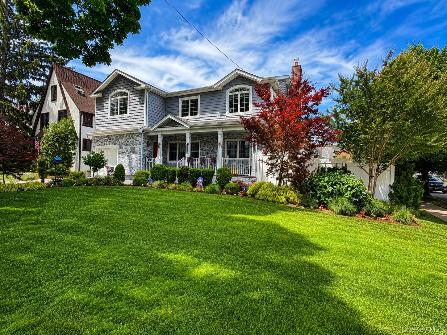 Oversized corner lot on tree lined street.