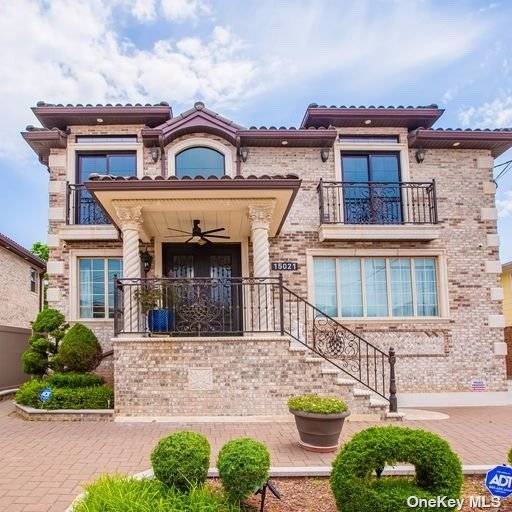 One of a kind, state of art, luxurious, contemporary stylish all brick extra large 2 family mansion situated in a desirable Queens neighborhood.