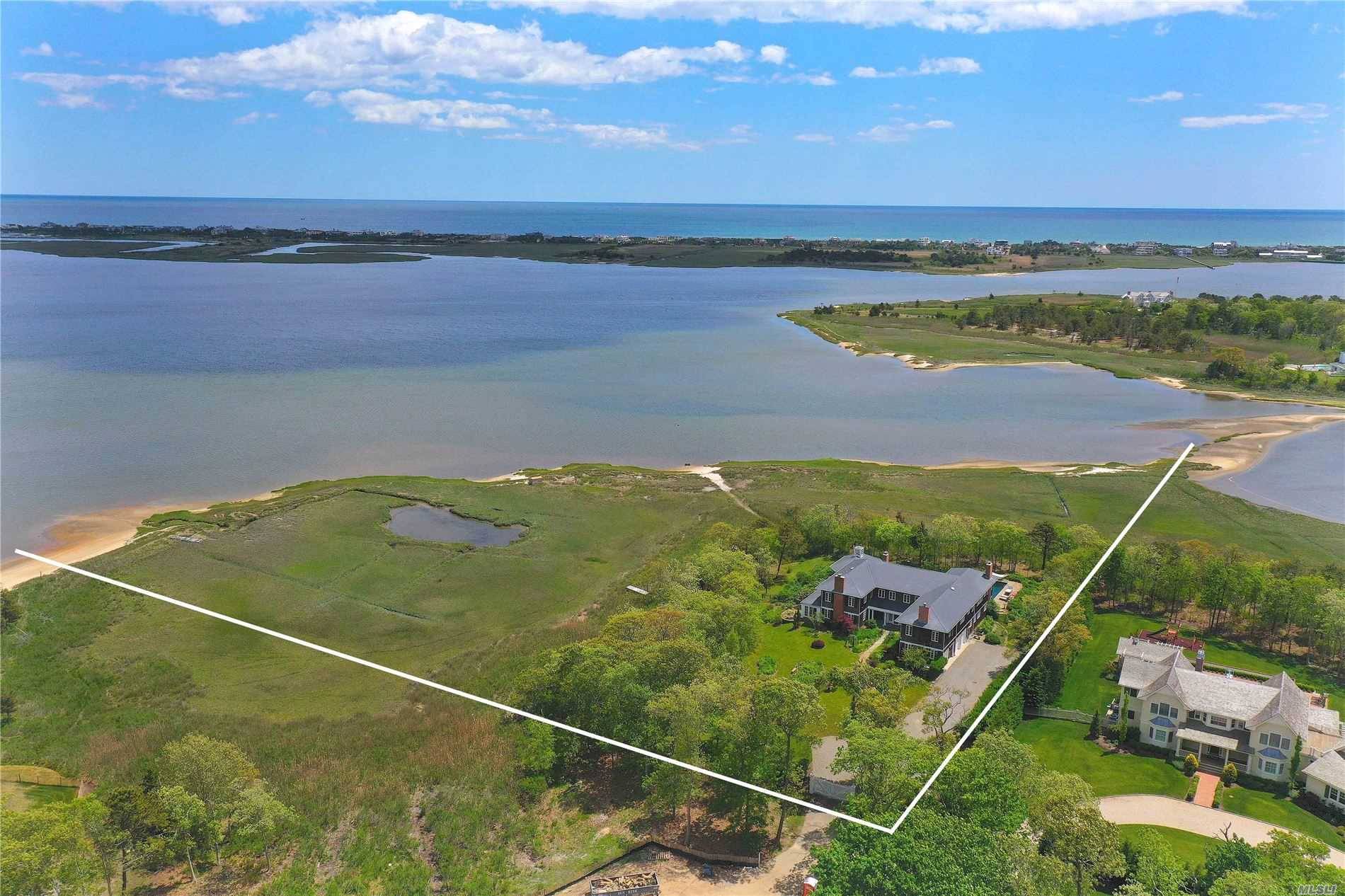 Set at the end of the prestigious Bay Road in Quogue, sits this exquisite waterfront home with breathtaking views of Shinnecock Bay.