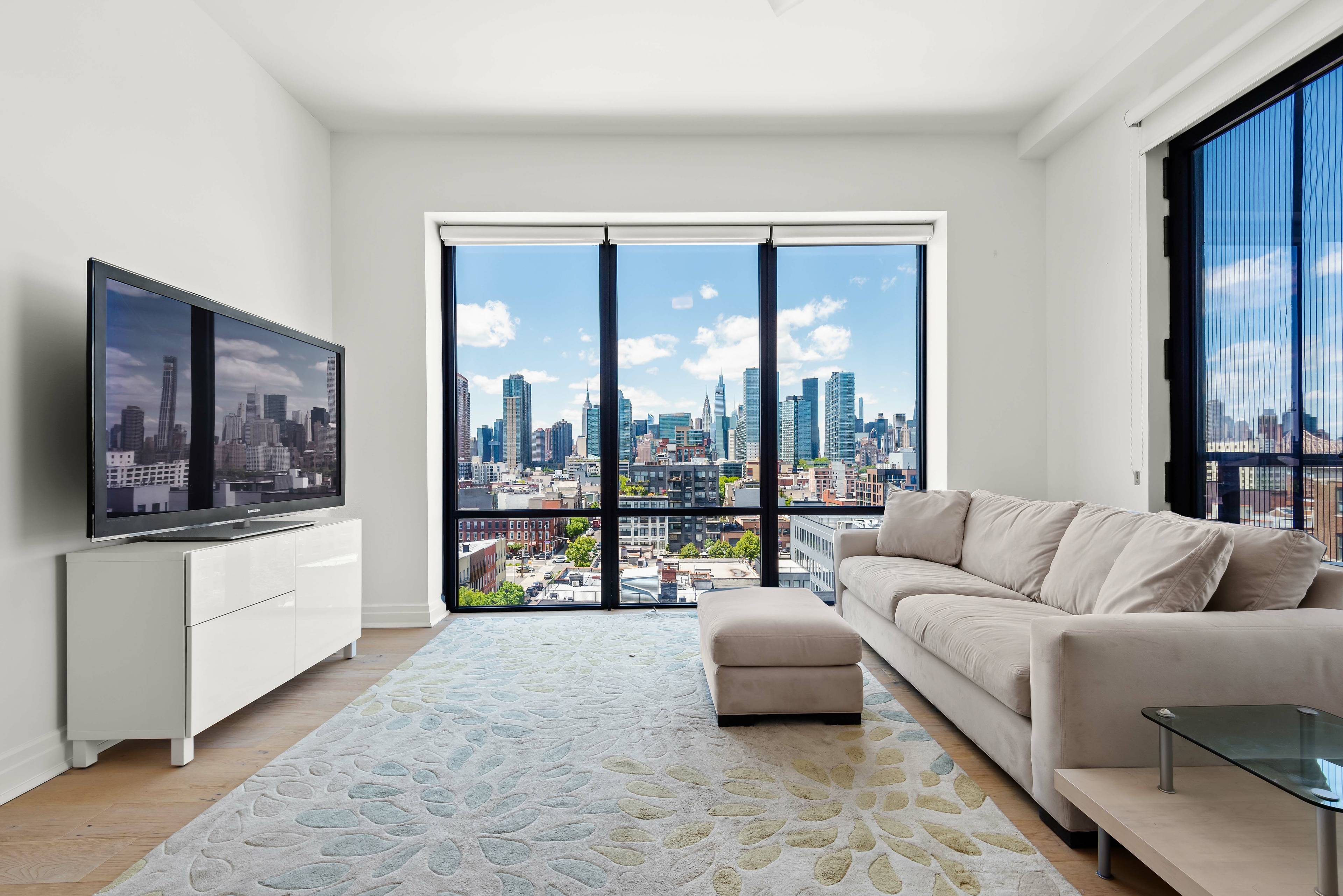 An immaculate corner condo with picturesque Manhattan views and private outdoor space, this 2 bedroom, 2 bathroom home is a paradigm of modern Long Island City living.