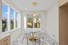 Dining area featuring light marble finish flooring, recessed lighting, and plenty of natural light