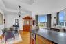 Kitchen featuring wine cooler, recessed lighting, light wood-type flooring, and expansive windows