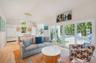 Nice open floor plan with plenty of light and tropical views