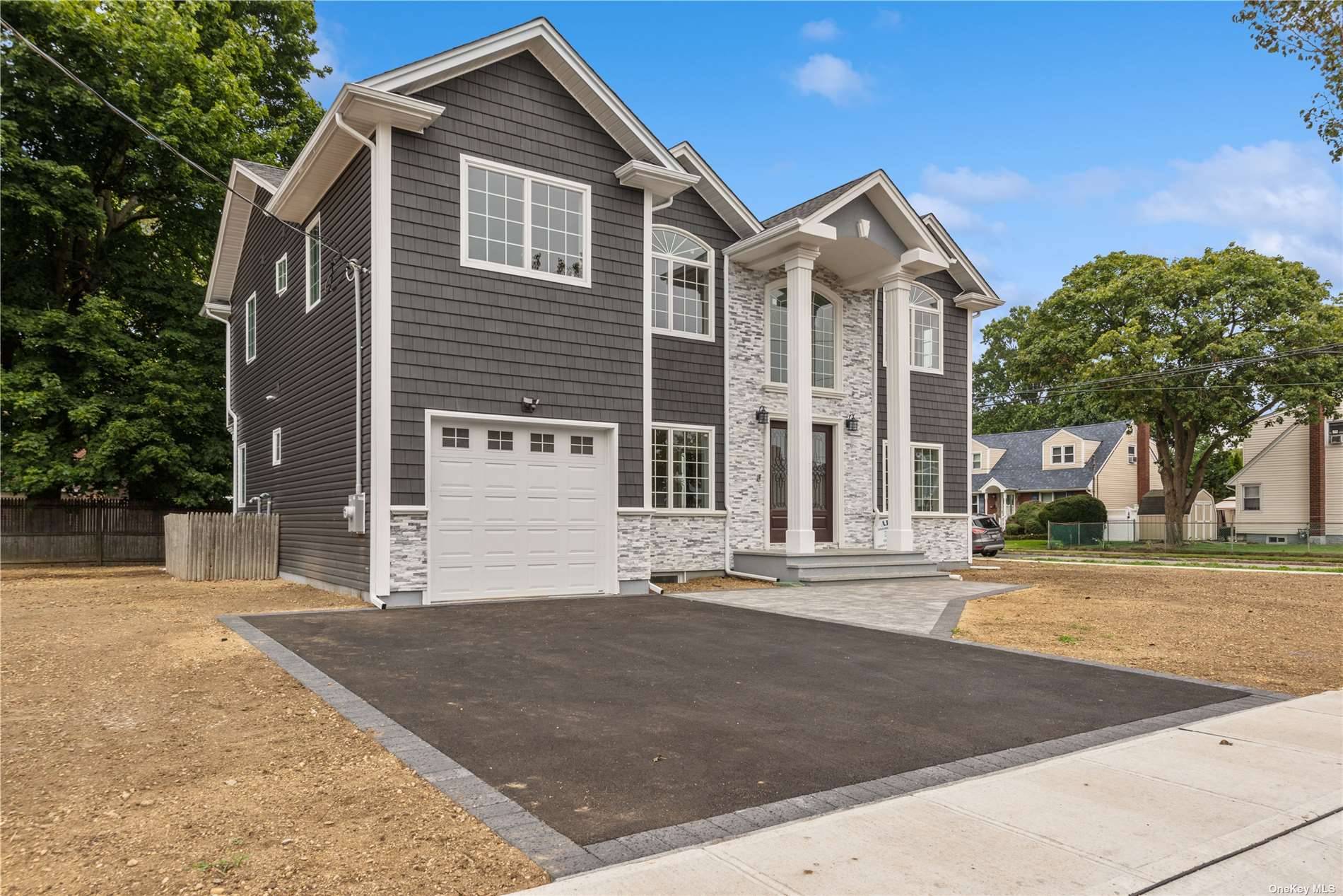 Discover this Hicksville gem boasting a one car garage and a harmonious first floor layout a living room, dining area, family room, kitchen, and half bathroom.