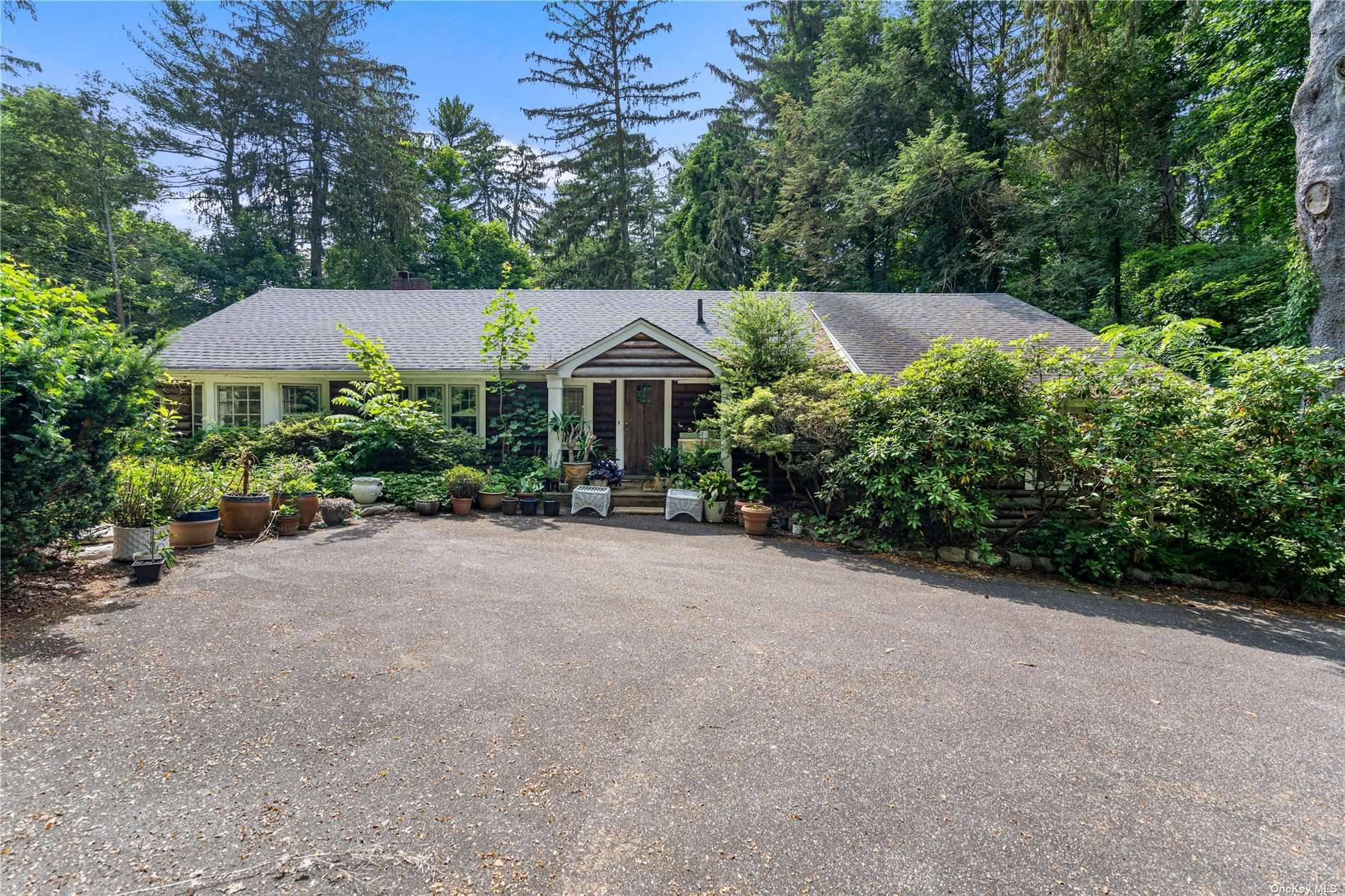 Brookville. Nestled in the depths of Brookville is this original log cabin property with additional detached 2 car garage and in ground swimming pool on a private and secluded 2.
