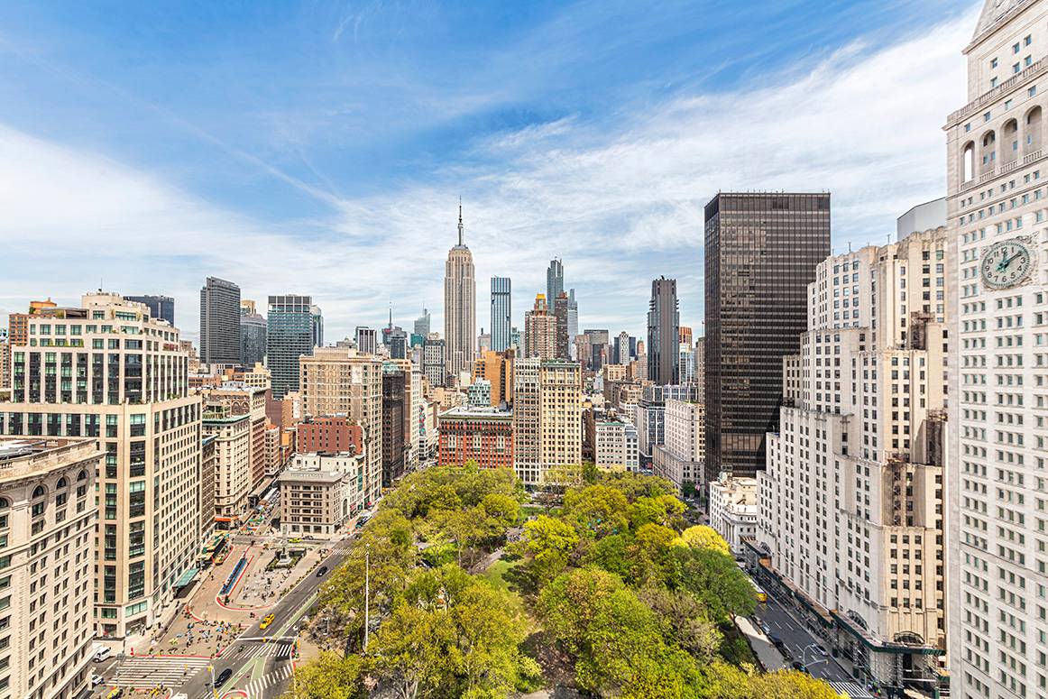 Stunning views of Madison Square Park, ESB, Met Life Clock Tower and midtown from oversized windows.