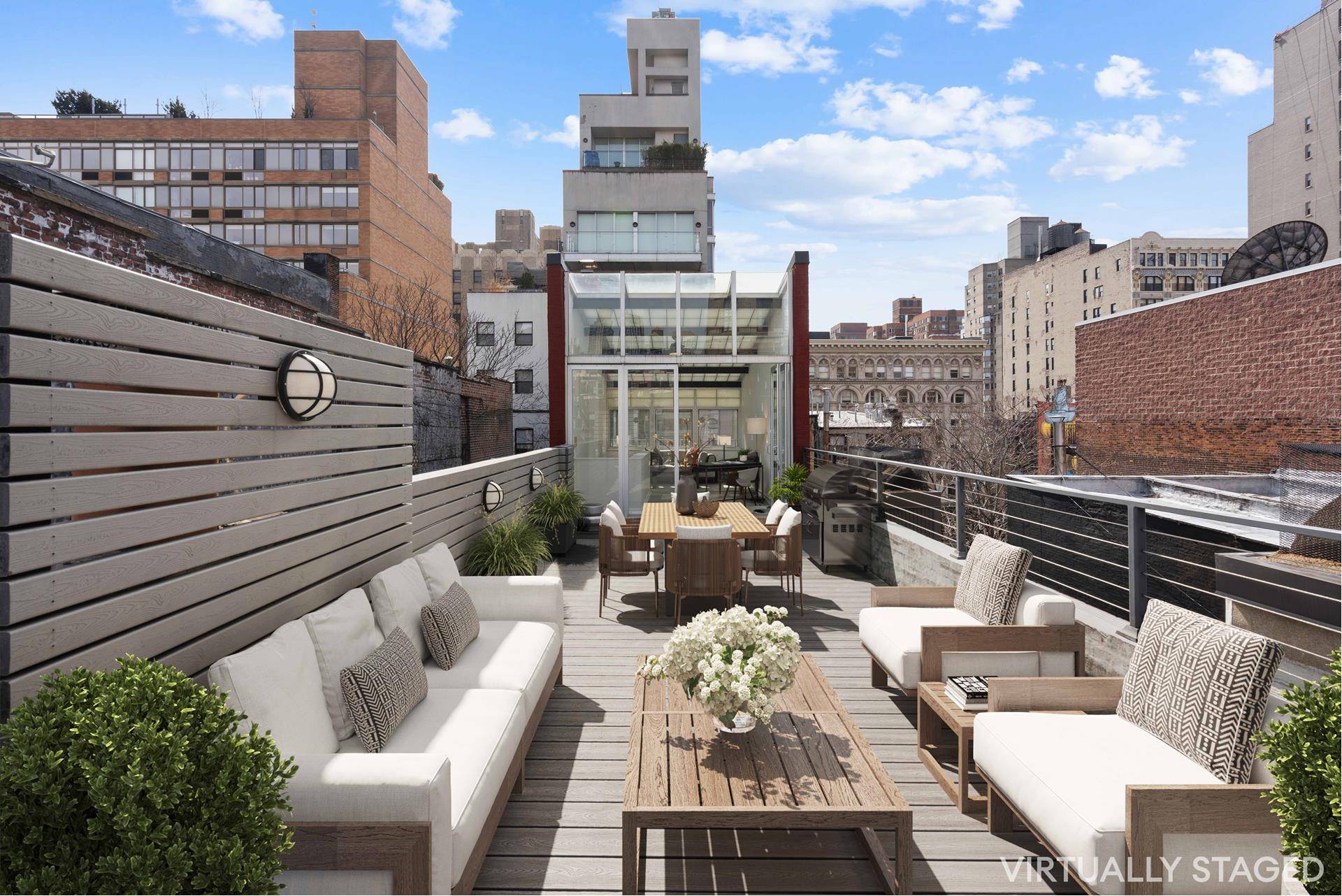 This rarely available townhouse condo offers four, large bedrooms over three floors and an additional, enclosed rooftop solarium, plus a large roof deck with views of the Empire State Building.