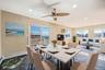 Dining area with ceiling fan, recessed lighting, and an AC wall unit