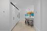 Hallway featuring recessed lighting, ornamental molding, and light wood finished floors