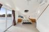 Bedroom with ceiling fan, a wall mounted AC, access to outside, and multiple windows