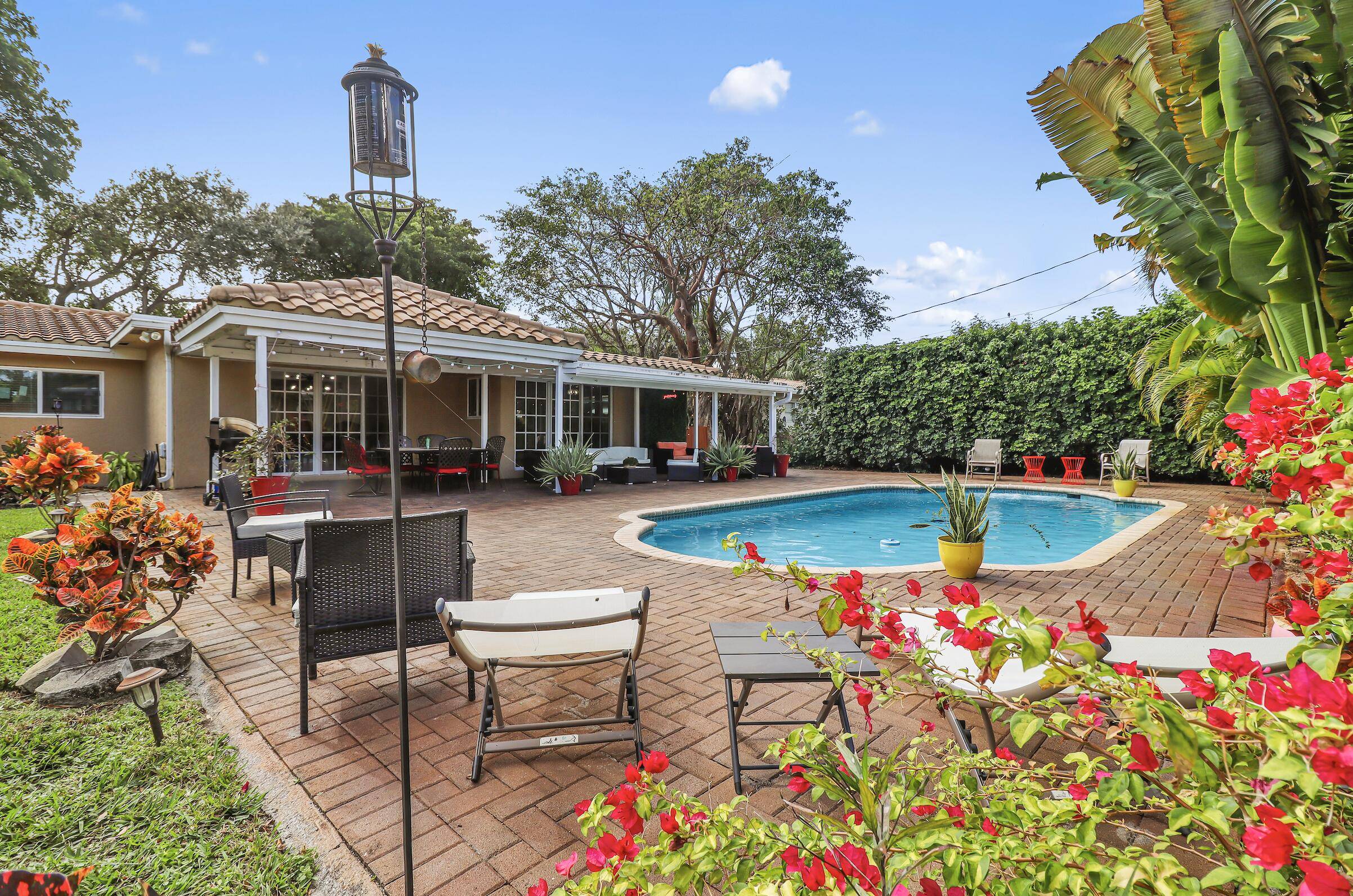 Discover luxury in Lighthouse Point, FL with this exquisite 4 bed, 3 bath home, featuring a heated pool and expansive backyard on a spacious 11, 929 sqft lot.