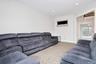 Living area with recessed lighting and carpet floors