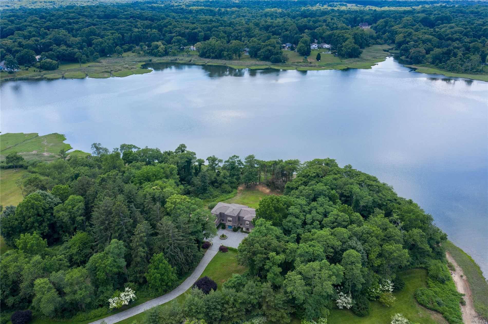 Serene and secluded waterfront property on 5 acres located in the picturesque village of Mill Neck.