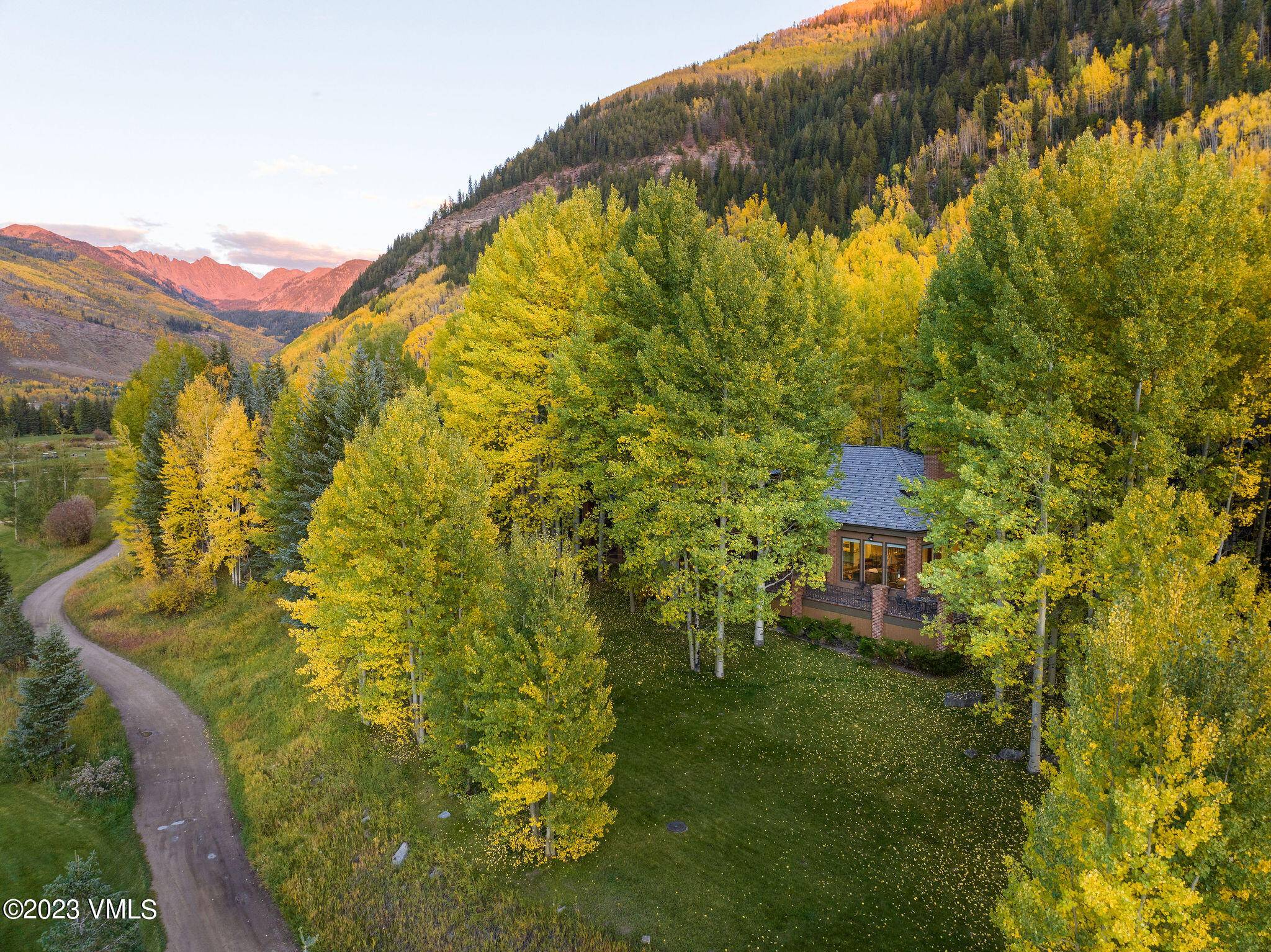 Set in one of the most private parts of the Vail Golf Course on dead end Sunburst Drive, this home delights upon entry with a high ceilinged living room wrapped ...