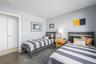 Bedroom featuring visible vents and wood finished floors