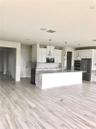 Unfurnished Kitchen with double sink and double oven
