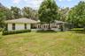 Rear elevation of the home surrounded by 17+ acres of beautiful Ocala countryside