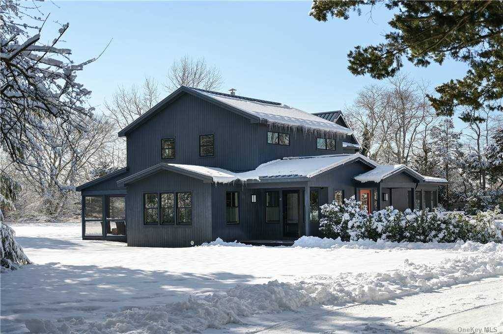 Modern luxury and antique charm coalesce for chic Hamptons living from the moment you enter this exquisite custom home.