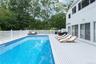 View of swimming pool featuring outdoor dining space, a wooden deck, and an outdoor hangout area