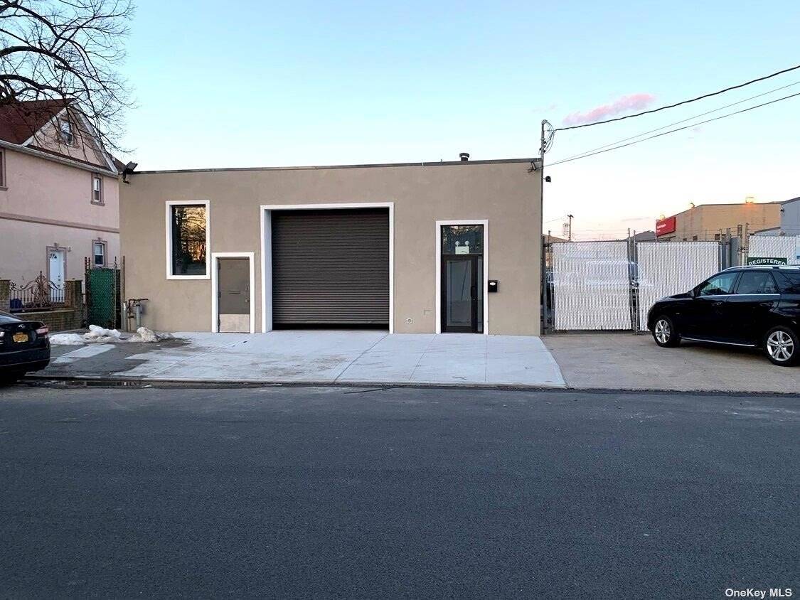 Warehouse with drive in door on a double wide street.