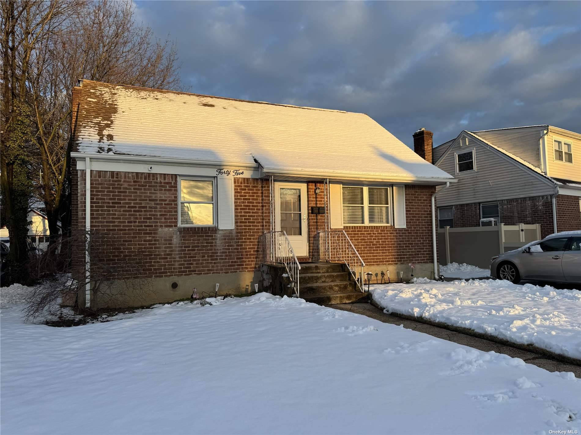BRICK CAPE FEATURES 4 BEDROOMS, FULL BATH, EIK, DR, DETACHED GARAGE, AND FULL BASEMENT WITH OSE !