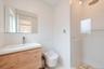 Bathroom with a stall shower and vanity