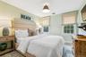 Bedroom with multiple windows