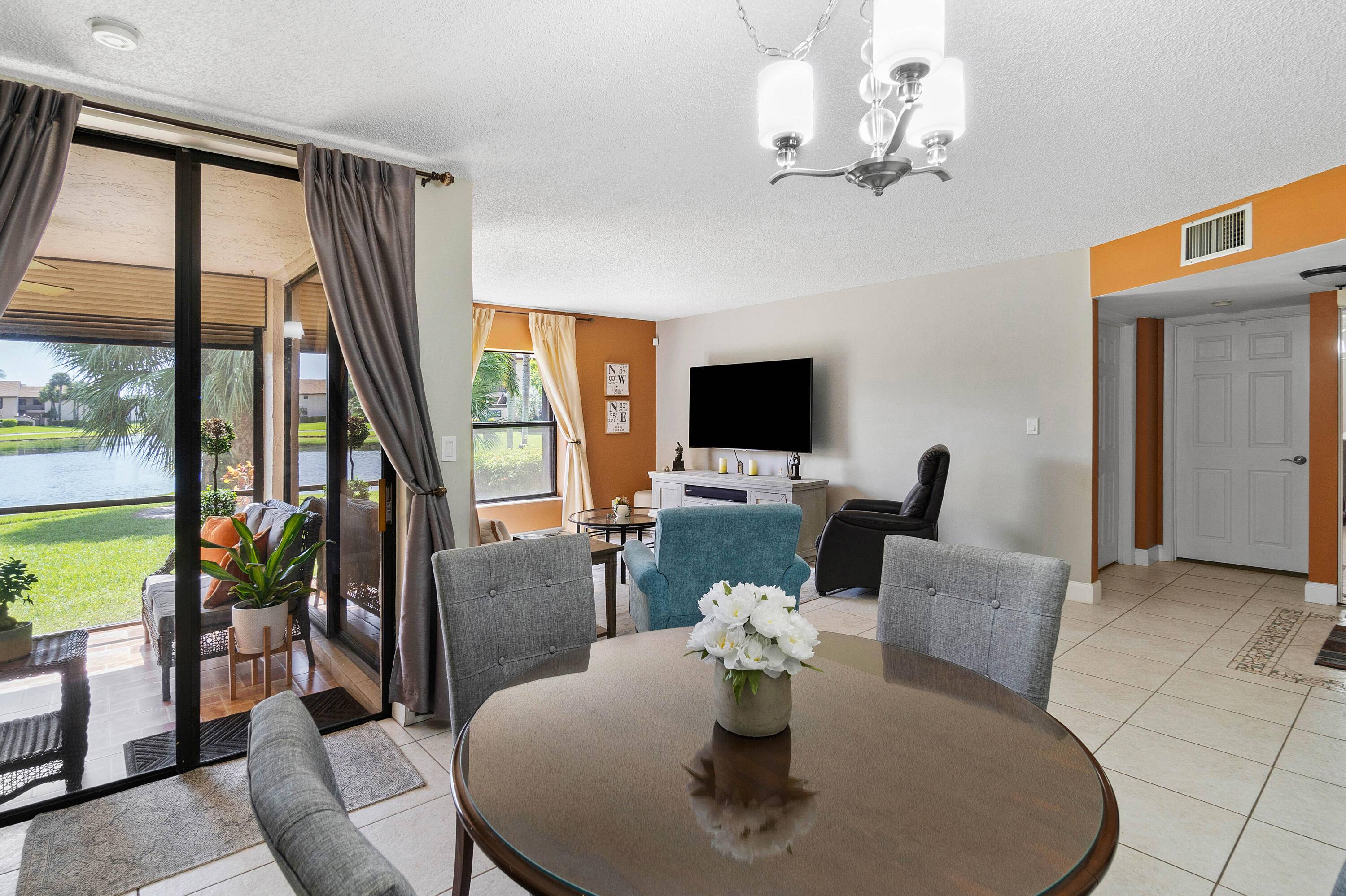 Located in a quaint all ages community of Boca Glades, this spacious 2 bed 2 bath split bedroom ground floor condo comes with a screen in patio overlooking a beautiful ...