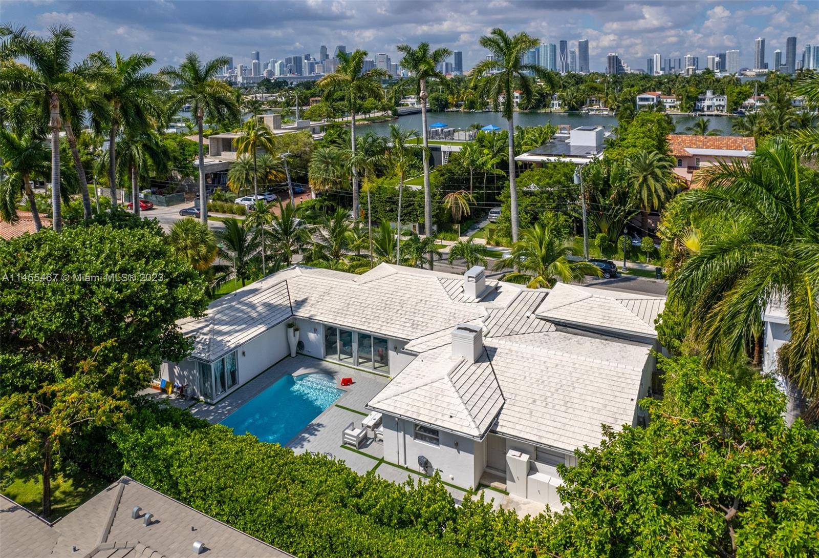 Welcome to this exceptional 4 bed, 4 bath, 3, 800 sqft single family home on an expansive 11, 250 sqft corner lot, a rare find in Miami Beach's Venetian Islands.
