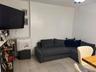 Living area featuring light tile patterned floors