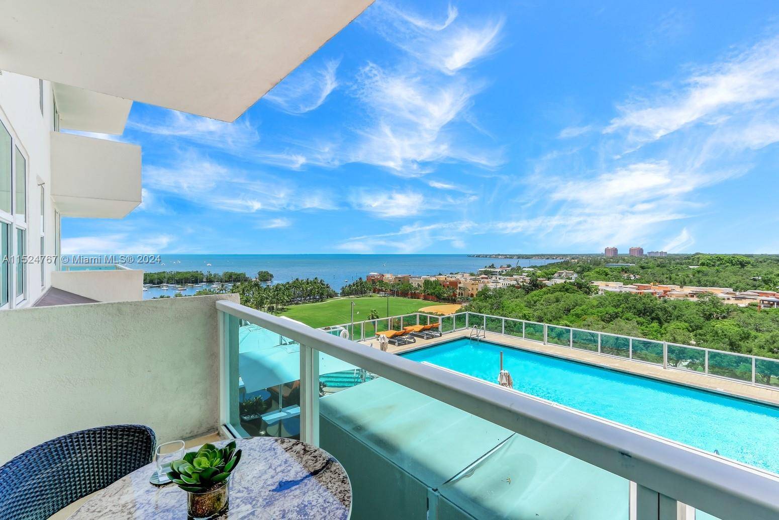 Stunning residence with bay, pool city views in Arya, a full service luxury condo hotel in the heart of Coconut Grove s historic village.