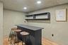 Bar with recessed lighting, light wood-style flooring, and baseboards