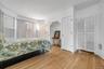 Bedroom featuring crown molding and light wood finished floors